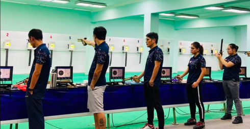 Vietnamese marksmen gather together in Hanoi as they gear up to compete in an online international shooting tournament on August 28.