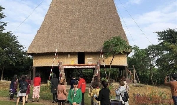 Tourists visit the Vietnam National Villages for Ethnic Culture and Tourism in 2019.